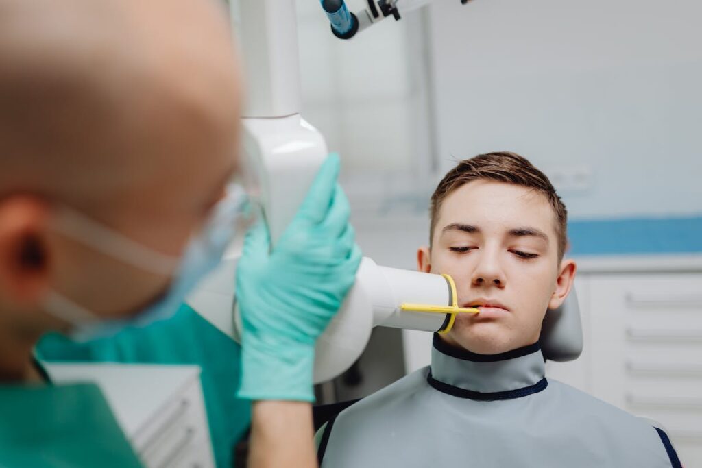 A Medical Professional Using a Dental Equipment on a Patient