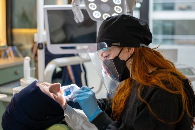 A Dentist Examining a Patient at a Dental Clinic