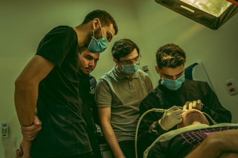 Men Watching Dentist at Work