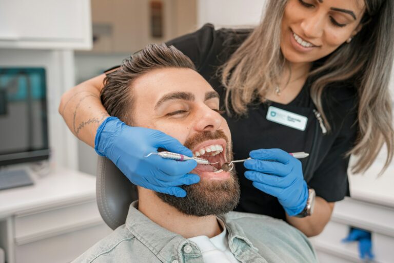 A person brushing a person's teeth photo