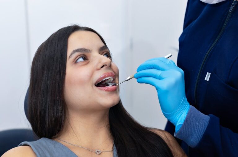 Dentist Examining Patient's Teeth in Belo Horizonte Clinic